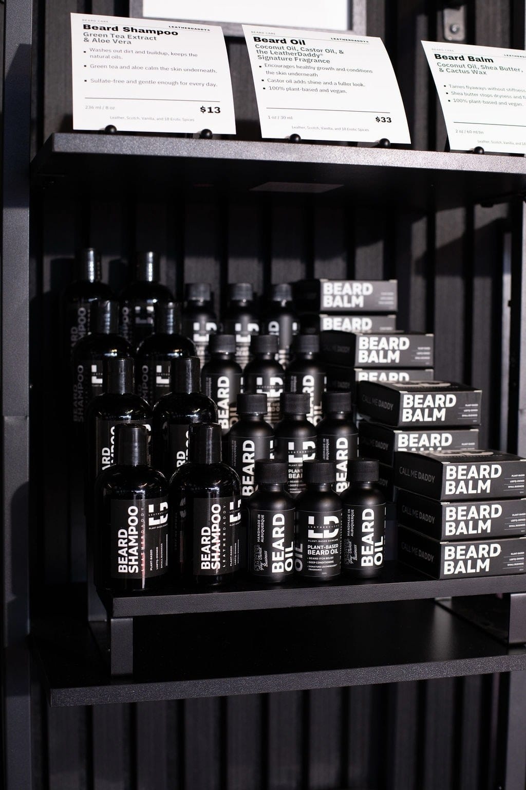 LeatherDaddy beard oil, shampoo, and balm on the store shelf.